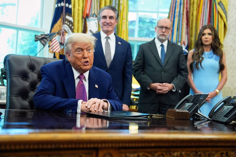President Donald Trump speaks to the media in the Oval Office at the White House, Tuesday, June 10, 2025, in Washington, as Interior Secretary Doug Burgum, Director of the Office of Management and Budget Russell Vought and Secretary of Homeland Security Kristi Noem, look on.