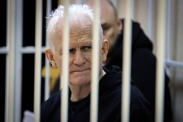 Ales Bialiatski sits in a defendants' cage during a court session in Minsk, Belarus, in January. He was sentenced to 10 years in prison on Friday.