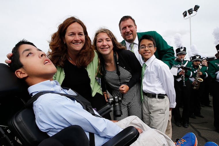 Michael Keating (left), with parents Kristin and Chuck; sister, Katie; and twin brother, Chris. More than 940 donations totaling more than $115,000 have come in to help the family through an online fund-raiser. (CHARLES FOX/Staff Photographer)