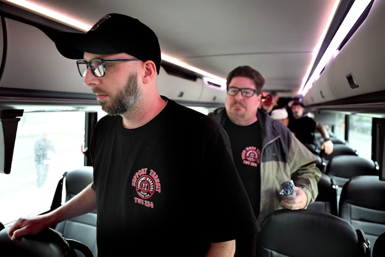 Transport Workers Union Local 234 members Bill Maxwell (left) and Barry Paul (right) leave their bus as they arrive in Harrisburg on Tuesday, May 13, 2025.