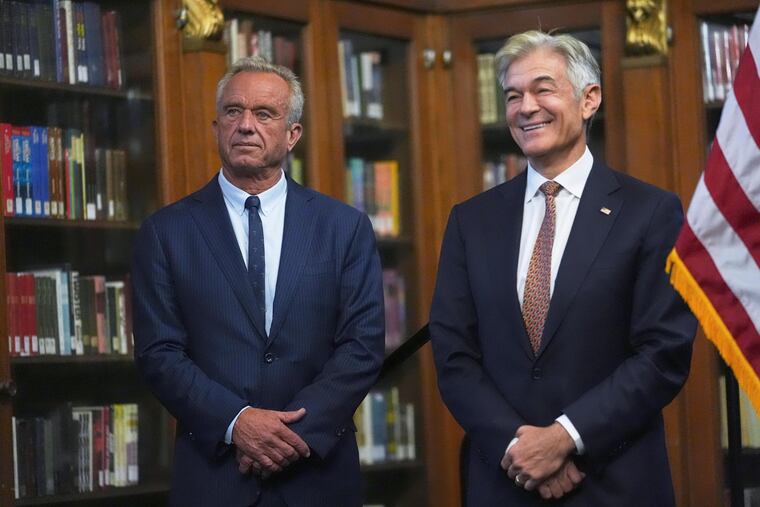 U.S. Health and Human Services Secretary Robert F. Kennedy, Jr., left, and Centers for Medicare and Medicaid Services Administrator Dr. Mehmet Oz appear an April event in Indiana in this file photo. Oz, a former U.S. Senate candidate, visited Philadelphia Monday.