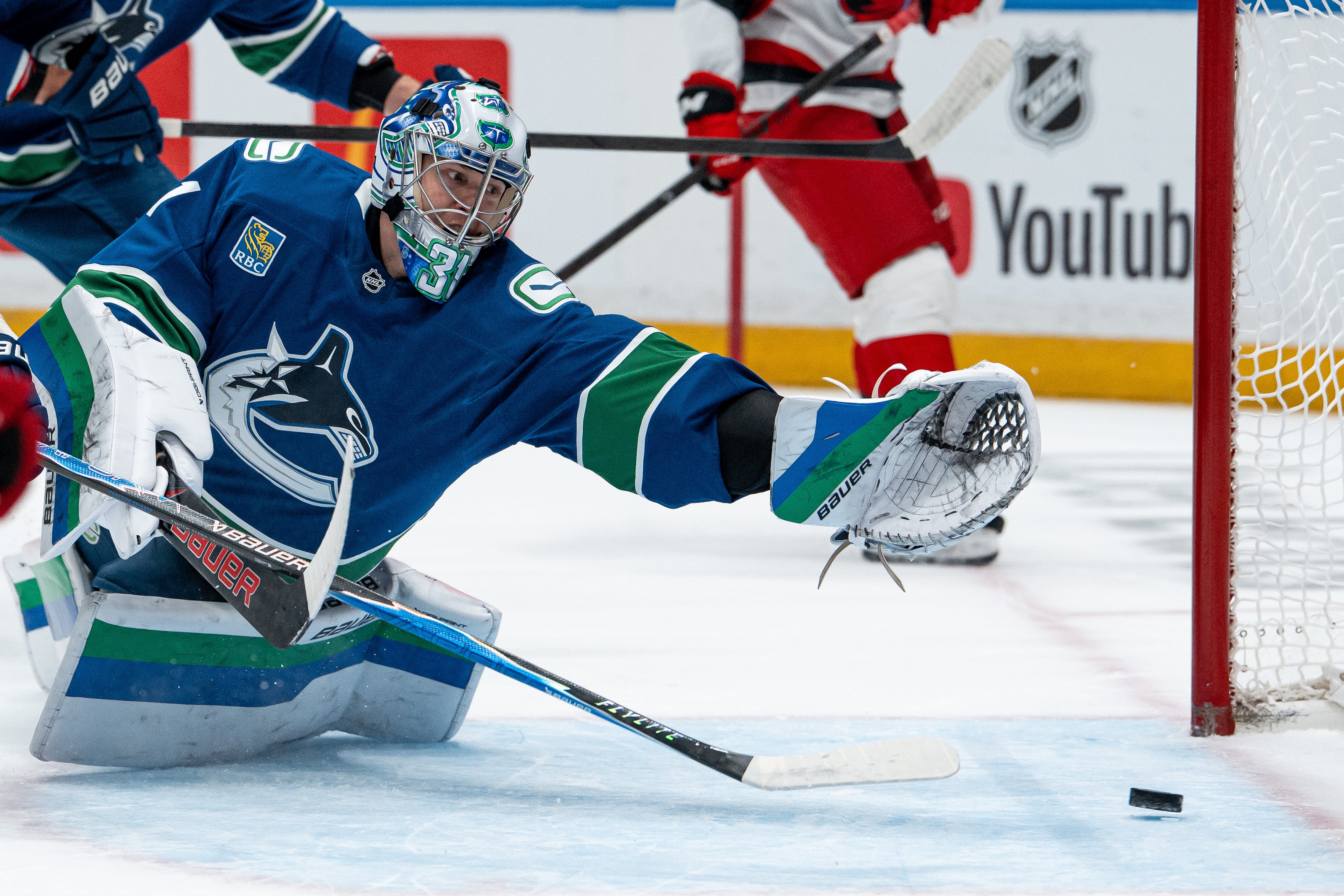 Defending champion Hurricanes beat Canucks 6-3 to take NHL lead