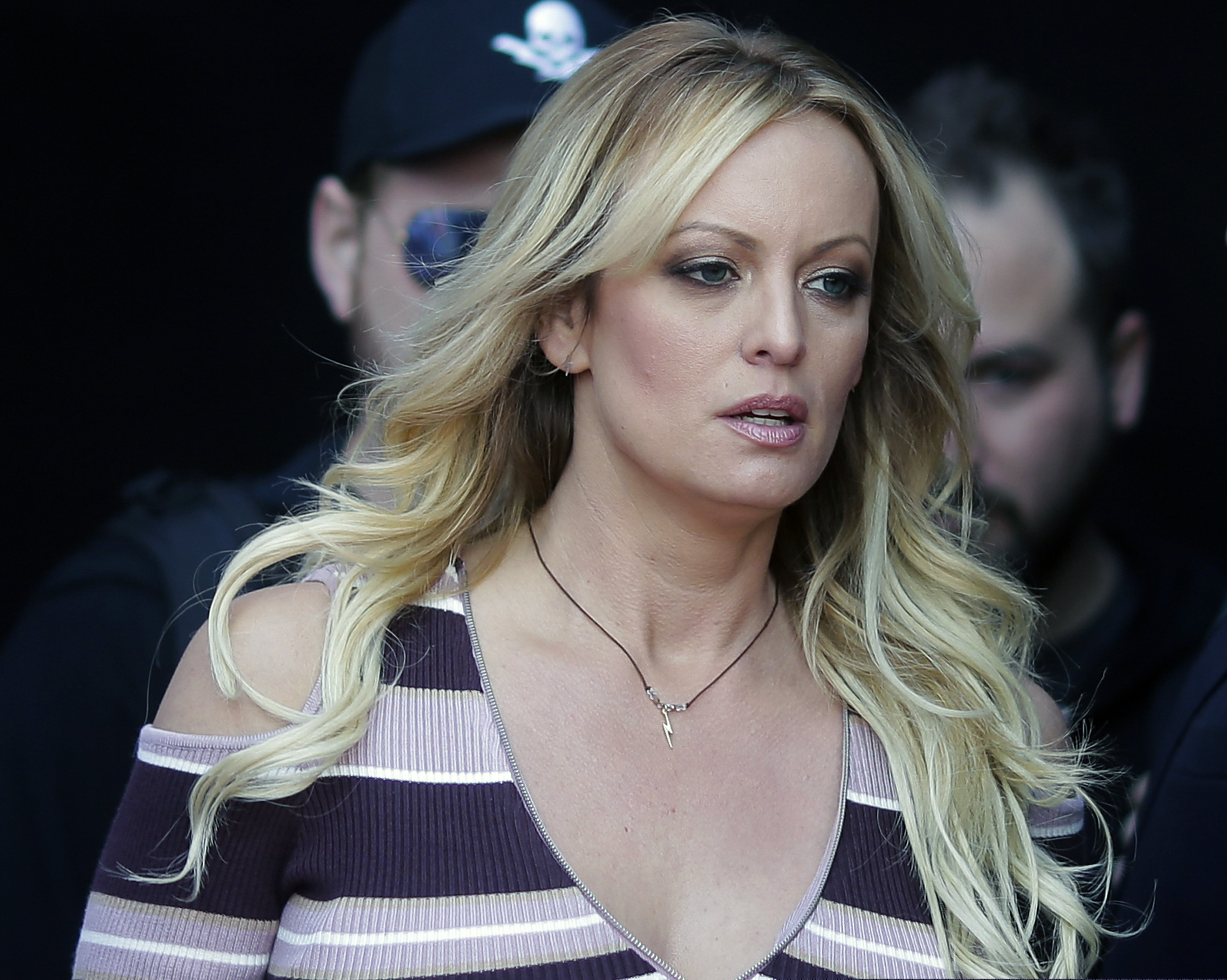 FILE - In this Oct. 11, 2018, file photo, adult film actress Stormy Daniels arrives at the adult entertainment fair "Venus" in Berlin. A federal judge has thrown out a lawsuit against President Donald Trump by Daniels that sought to tear up a hush-money settlement about their alleged affair. Judge S. James Otero ruled Thursday, March 7, 2019, in U.S. District Court that the suit was irrelevant after Trump and his former personal lawyer agreed to rescind a nondisclosure agreement Daniels signed in exchange for a $130,000 payment.