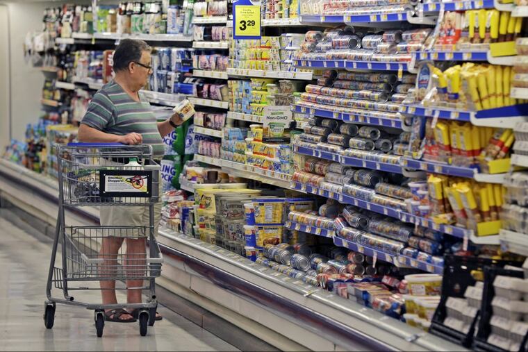 A new, peer-reviewed government report, published by the Agriculture Department in November, suggests changes to packaged foods have not made the products more healthful overall (AP Photo/LM Otero, File)