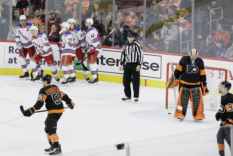 The Rangers celebrate after Ryan Strome got a goal past the Flyers' Carter Hart with 2.6 seconds to go in the first period on SUnday.