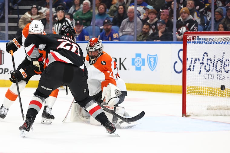 Sabres right wing Jack Quinn (center) puts the puck past Flyers goaltender Sam Ersson during the first period Thursday night.