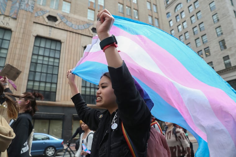 Students marched around City Hall after they walked out of school to protest anti-trans legislation in Philadelphia on Tuesday.