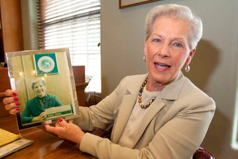 Letitia "Tish" Colombi, Haddonfield commissioner and mayor, holds a photo from her first day in office.
