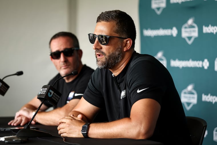 Eagles general manager Howie Roseman and coach Nick Sirianni speak during the first day of training camp on July 29.