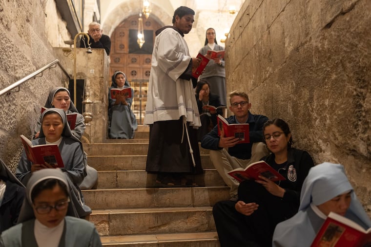Christians attend Mass in the Church of the Holy Sepulchre in the Old City of Jerusalem on May 7.