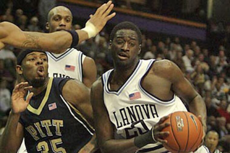 Villanova's Shane Clark beats Pittsburgh's Nasir Robinson to a rebound during the second half. (Yong Kim / Staff Photographer)