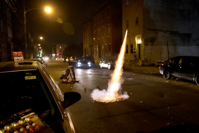 Fireworks shoot into the sky from N. 22nd St., near W. Norris St., in North Philadelphia on June 26, 2020.