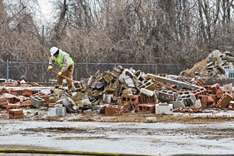 Rubble is all that remains after workers demolished the site of the former Kiddie Kollege Day Care in Franklinville on Jan. 13. ( David M Warren / Staff Photographer )