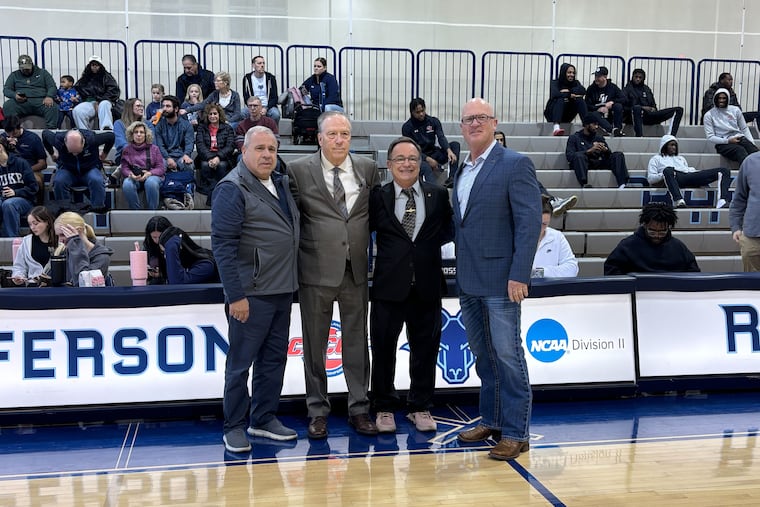Thomas Jefferson University women's basketball coach Tom Shirley (second from left) celebrates his induction into the Pennsylvania Sports Hall of Fame with Jefferson AD Corey Goff and Hall officials Rich Scaglione and James Parrella.