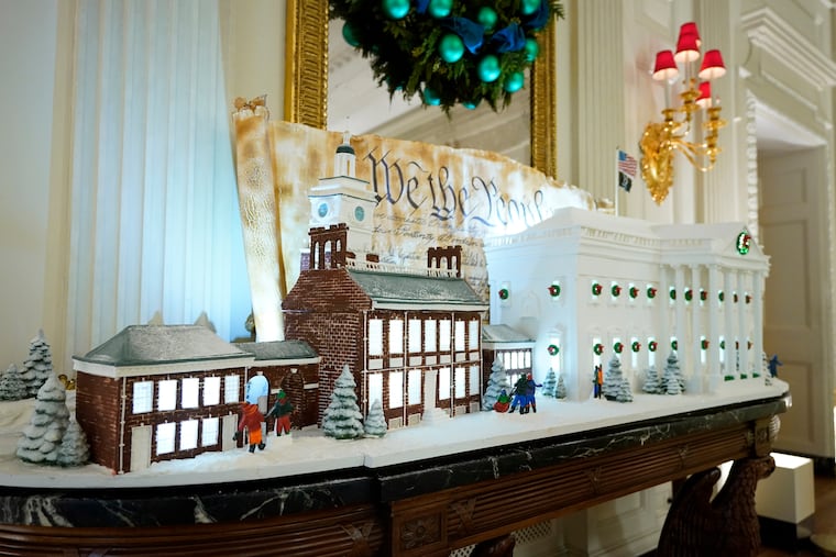 A sugar cookie replica of Independence Hall and a gingerbread replica of the White House are on display at the White House.