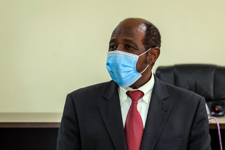 Paul Rusesabagina appears in front of media at the headquarters of the Rwanda Bureau of investigations building in Kigali, Rwanda Monday, Aug. 31, 2020. Rusesabagina, who was portrayed in the film "Hotel Rwanda" as a hero who saved the lives of more than 1,200 people from the country's 1994 genocide, and is a well-known critic of President Paul Kagame, has been arrested by the Rwandan government on terror charges, police announced on Monday, Aug. 31, 2020.