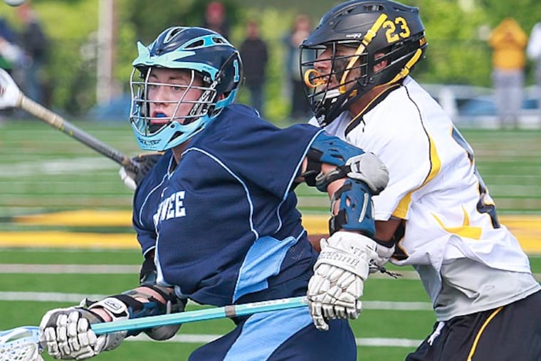 Shawnee High School's David Smith (left) and Moorestown High School's Anthony Labetti try to get a ball during the second period. Shawnee High School won over 4-3 from Moorestown High School at overtime at Wesley Bishop Field, Moorestown, NJ. (Akira Suwa/ Staff Photographer)