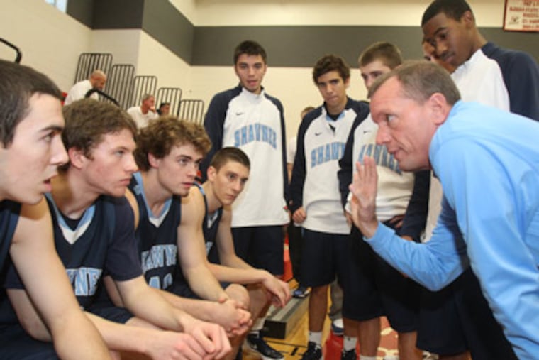 Head Coach Joe Kessler, right, of Shawnee huddles his team before their game against Atlantic City. ( Charles Fox / Staff Photographer ) JSHAW19P, 12/18/2011, OCEAN CITY PBA TIPOFF WEEKEND, ATLANTIC CITY VS. SHAWNEE, Ocean City HS 501 Atlantic Avenue Ocean City NJ 08226