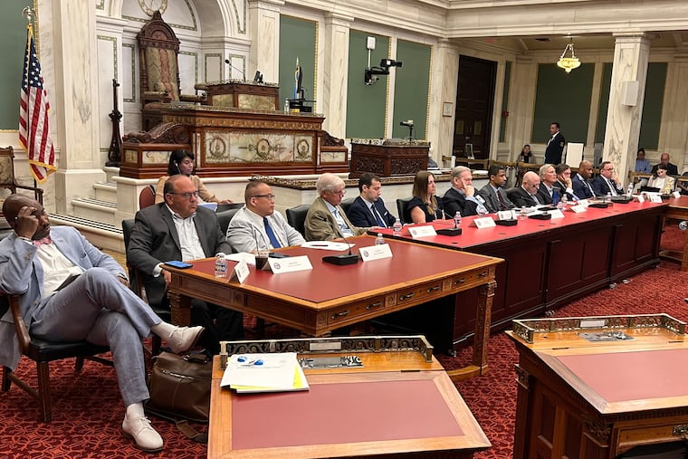 The Philadelphia Tax Reform Commission held its first public meeting on Monday in City Council chambers. The commission includes, from left, former Councilmembers and mayoral candidates Derek S. Green, Allan Domb, and David Oh.