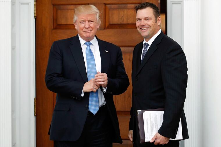 Kansas Secretary of State Kris Kobach, the voter fraud commission’s vice chairman, with President Trump in November.
