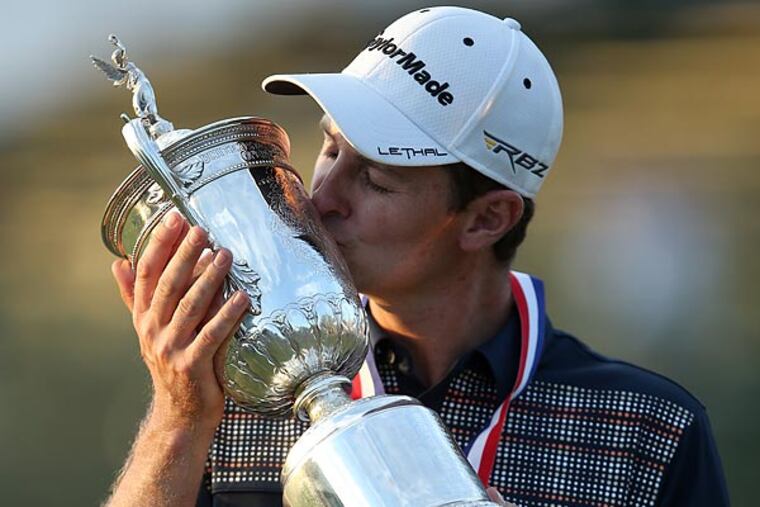 Justin Rose kisses the trophy after winning the U.S. Open golf tournament at Merion Golf Club. (Yong Kim/Staff Photographer)