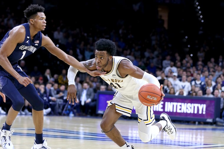 Villanova's Saddiq Bey drives on Georgetown's Jamorko Pickett in the second half of the Wildcats' 80-66 win, at the Wells Fargo Center on Saturday afternoon.