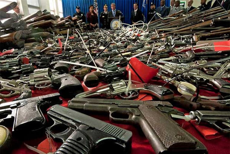 Some of the 1,337 guns turned in during a two-day gun buyback program in Camden County last month. (April Saul / Staff Photographer)