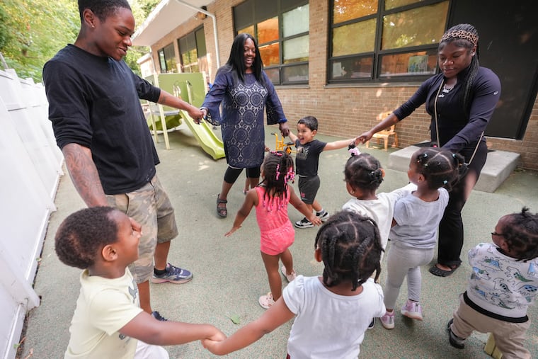 Josie Jones, director of the KenCrest program in Southwest Philadelphia, leads the Early Head Start group in play.