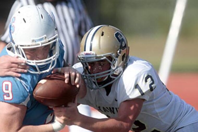 Father Judge's Anthony Walker can't hold on long enough for the extra point in a 35-34 loss to Council Rock South. (David Swanson/Staff Photographer)