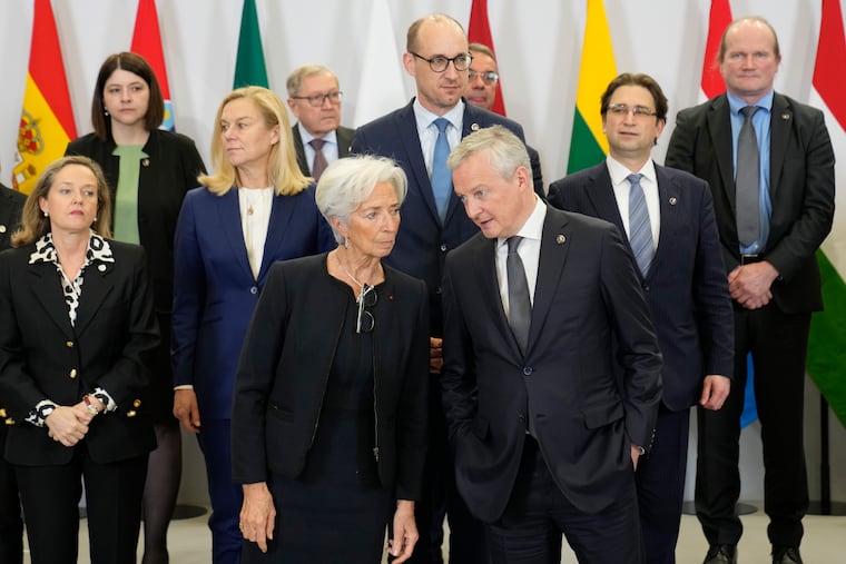 French Economy minister Bruno Le Maire (right) talks with President of European Central Bank Christine Lagarde as they pose for a picture during a European Finance Ministers meeting on Friday.