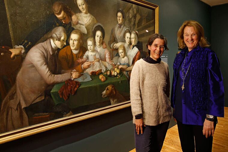In front of Charles Willson Peale's "The Peale Family" at the Art Museum are Peale descendants Lucy Bell Jarka-Sellers and Nan Chisholm. Chisholm, an art consultant and adopted, recently discovered by chance that she was a Peale.