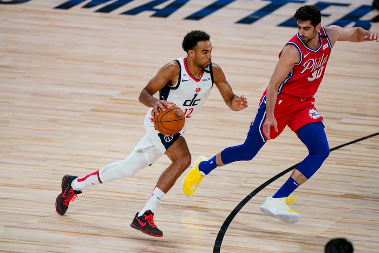 Washington Wizards guard Jerome Robinson bringing the ball up court against 76ers guard Furkan Korkmaz (30) on Aug. 5.