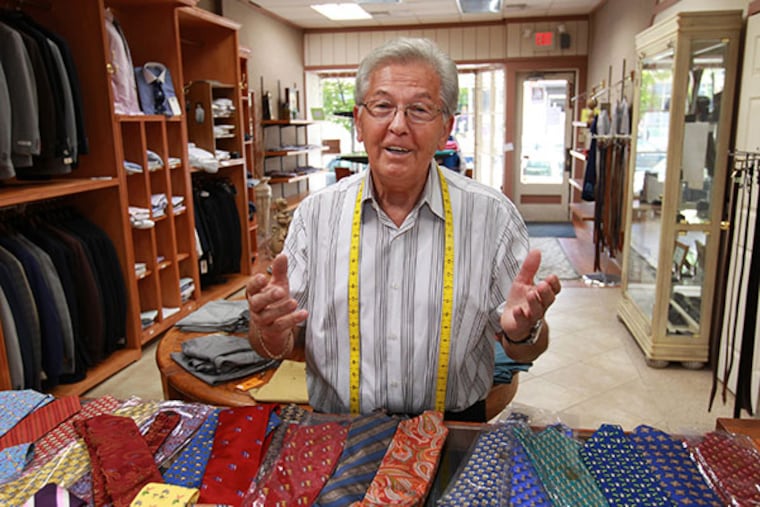 Surrounded by inventory in DeRito's Clotherir, Dino DiMucci talks about making suits in downtown Philadelphia in the 50's and 60s. ( MICHAEL BRYANT / Staff Photographer )