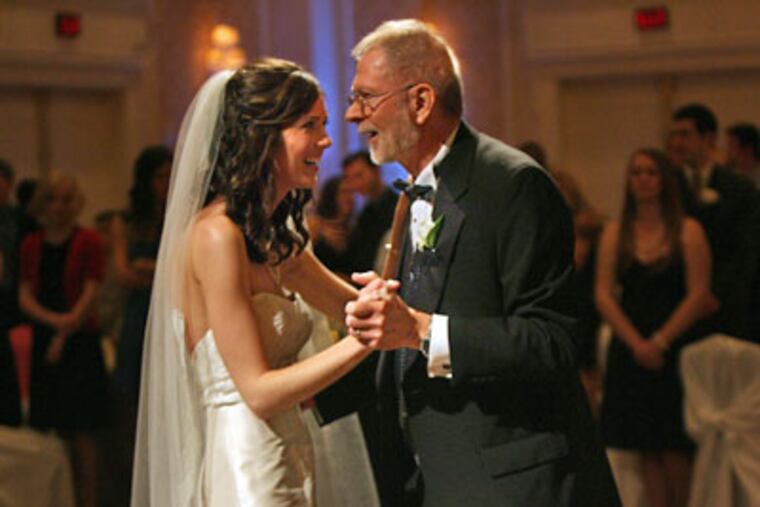 Tim Michalak, 64, right, dances with his daughter Allison Palmer, 24, during her wedding reception at the Dearborn Inn in Dearborn, Michigan. Michalak was diagnosed with glioblastoma in 2005 and says he is happy that he was able to be there for his daughter on her wedding day. (Kimberly P. Mitchell/Detroit Free Press/MCT)
