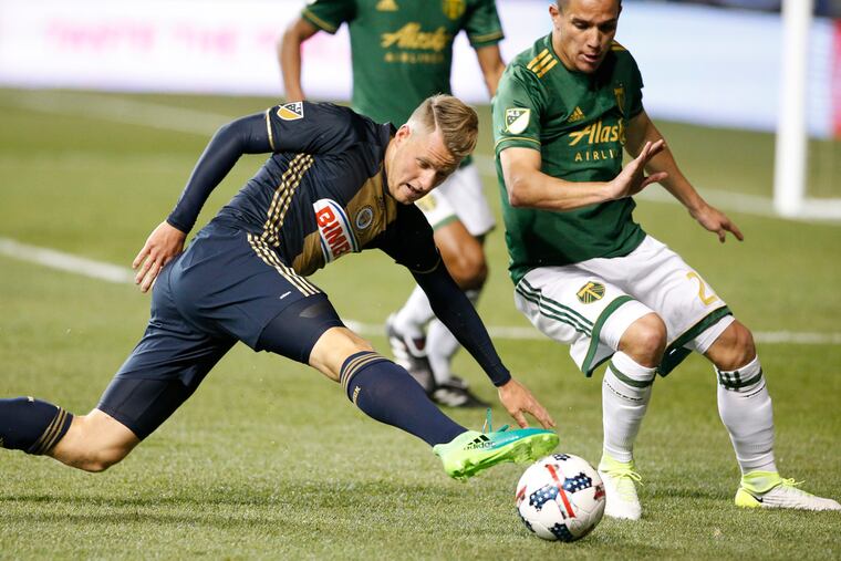 Fabian Herbers, left, of the Union and David Guzman, right, of the Portland Timbers go after the ball in the 2nd half on April 8, 2017 at Talen Energy Stadium. CHARLES FOX / Staff Photographer