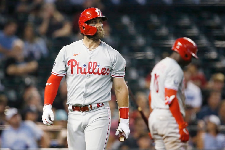 Bryce Harper of the Philadelphia Phillies walks back to the dugout after striking out against the Arizona Diamondbacks during the sixth inning at Chase Field on Tuesday, Aug. 17, 2021, in Phoenix. (Ralph Freso/Getty Images/TNS)