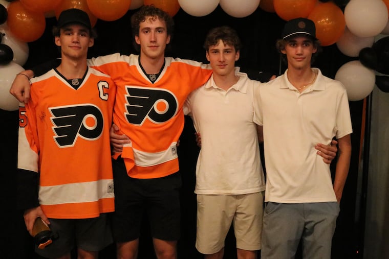 Matthew Gard (second from left) stands with his brothers (right to left) Luke, Graham, and Jack, who is a Flyers fan.