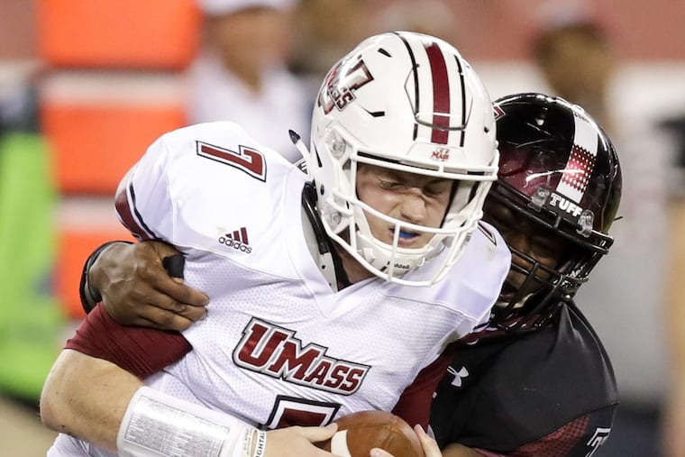 Temple defensive lineman Quincy Roche sacks UMass quarterback Andrew Ford during the first quarter Friday.