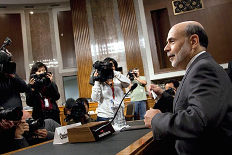 Federal Reserve Board Chairman Ben Bernanke arrives to testify before the Joint Economic Committee hearing on the economic outlook. (AP Photo / Evan Vucci)