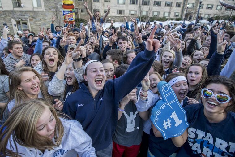 Bridie Dunn, center, a sophmore at Villanova, celebrates with her fellow classmates in the Villanova Quad after the Wildcats defeated Texas Tech to advance to the Final Four on Sunday March 25, 2018.