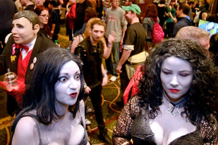 Cadavera (left) and Stabigail join fellow horror film fans in the lobby at the Monster Mania Convention.