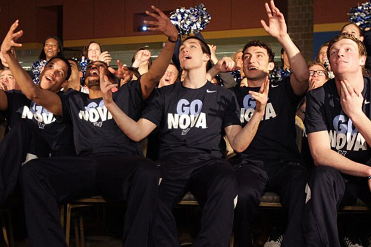 Villanova players react to a live television feed during the NCAA selection show viewing party at the Connolly Center. (David Maialetti/Staff Photographer)
