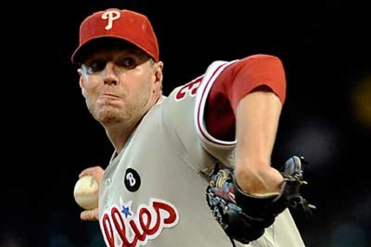 Roy Halladay pitched a complete-game shutout to clinch a playoff berth for the Phillies. (Pat Sullivan/AP)