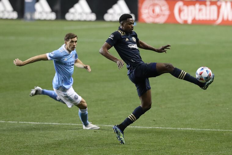 Cory Burke (right) traps a ball against New York City FC in the Union's loss at Subaru Park last Saturday.