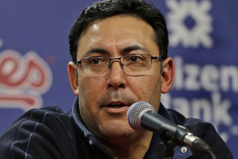 Welcome to the world of general manager Ruben Amaro Jr., who fielded questions about his struggling team. (Matt Rourke/AP file)