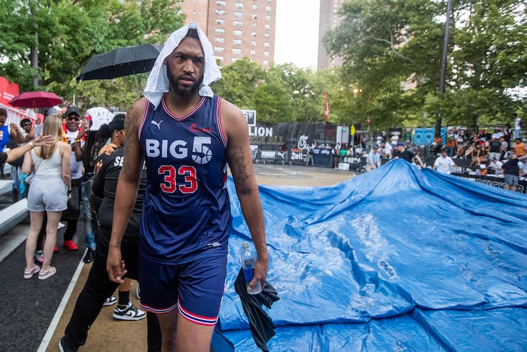 Jalen Robinson of the Big 5 team walks off the court at Rucker Park after The Basketball Tournament game was delayed by rain in the first quarter.