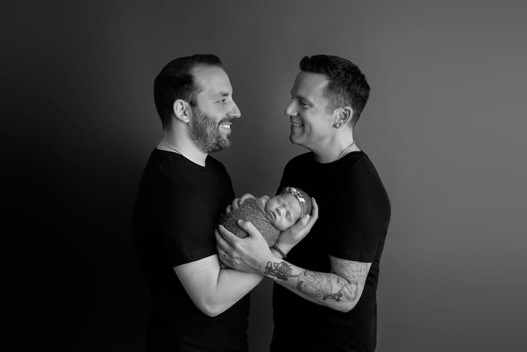 Mike (left) and Alex with daughter Olivia