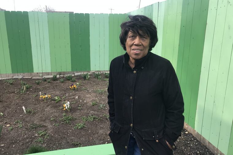 Elmira Smith in the community garden she and her neighbors created in Kensington. It is now threatened by an impending sheriff’s sale.
