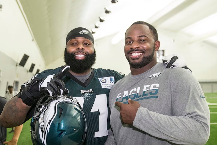 Jason Peters (left) and Fletcher Cox, shown here after a 2016 training camp practice, made the NFL All-Decade Team. CHARLES FOX / Staff Photographer
