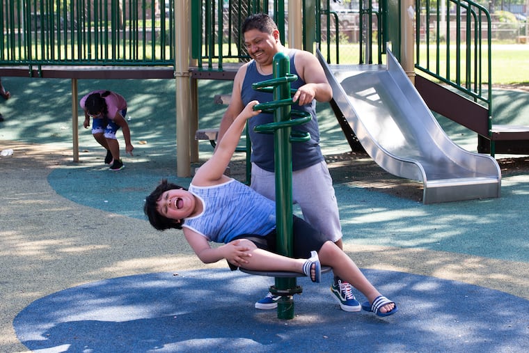 Spanish-speaking families are trying to make the application process for Parks and Recreation's summer camps more accessible to people who don't speak English as a first language. Fernando Melo and his son Javier, 9, are show in June at Murphy Recreation Center, where Javier will go to summer camp. Fernando is one of the dads who says he was only able to enroll his kids with the help of advocates